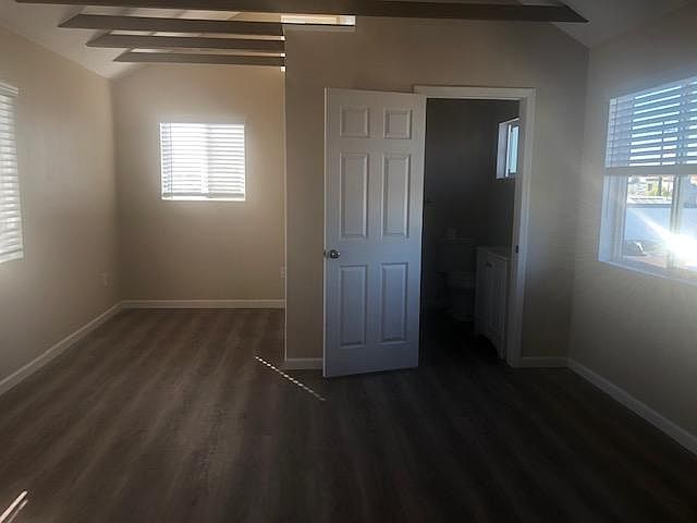 Room for Queen Size Bed tucked back from main living area