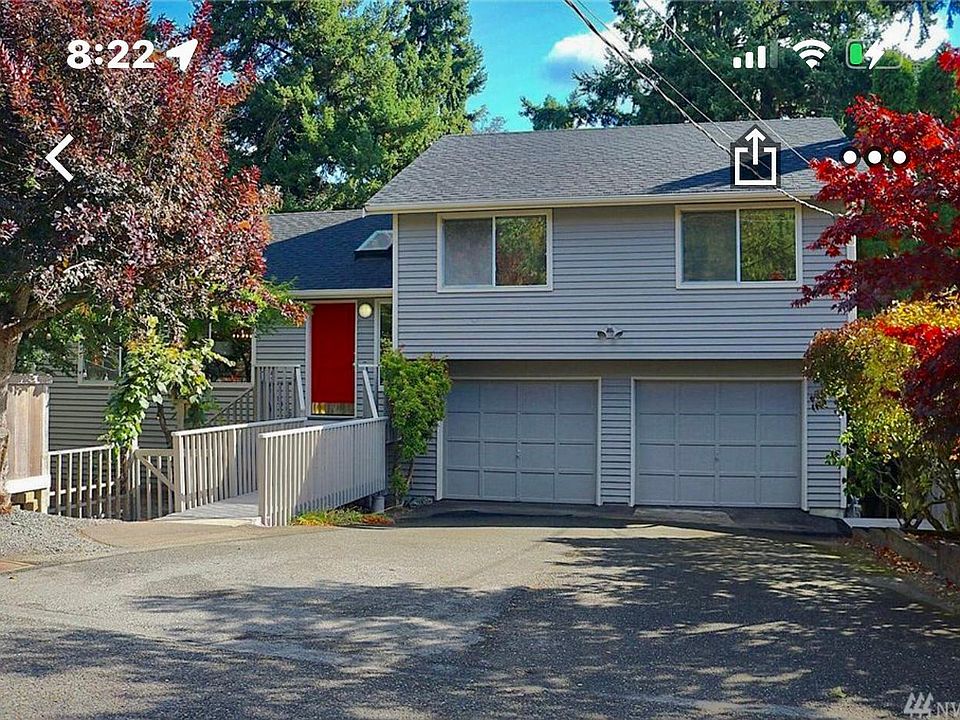 Front of home beautiful with ample parking maple trees. Huge two car garage. Available parking spaces of 6 to 8 vehicles if needed