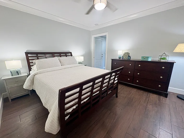 Fully bedroom furnishings with high quality queen size bed and mattress, high quality dresser, new stone lamps, new ceiling fan.