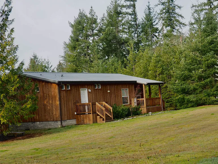 Front view of house with view of laundry room exit and entrance porch