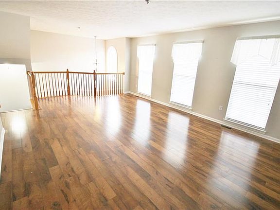 You will love the light and airy feel of the great room with gleaming laminate flooring.