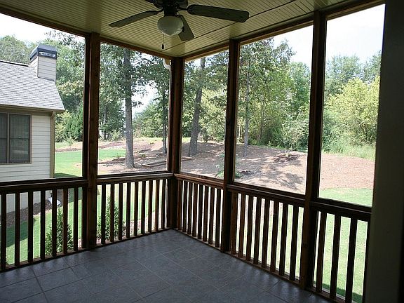 Screened porch off of the kitchen has a tile floor.
