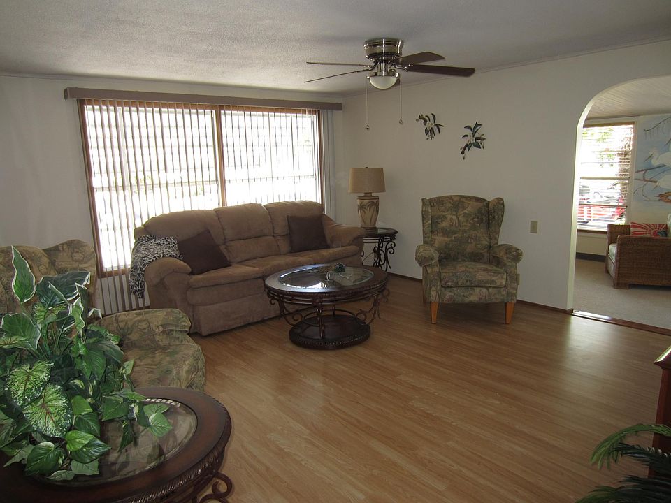 Spacious living room open to sun room