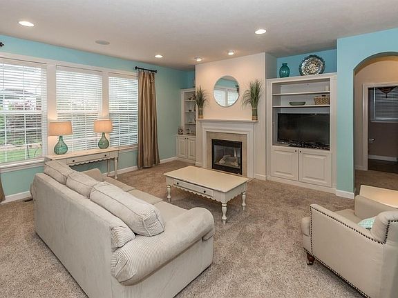 Love the great room with built in's, gas fireplace, lots of natural light and opens to the kitchen area.