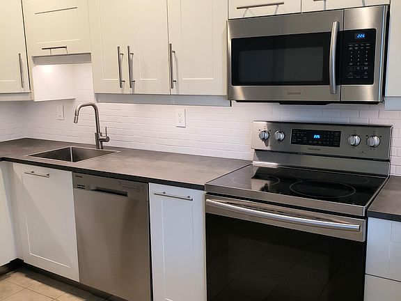 Updated appliances, garbage disposal, waste cabinet.