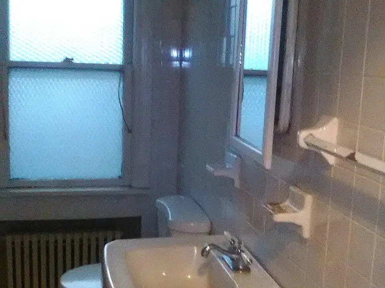 Bathroom with tub, next to bedroom on the main floor.
