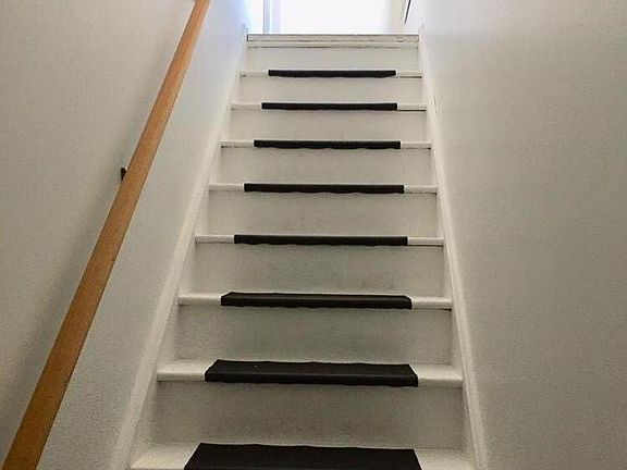 Inside stairs leading to apartment level.