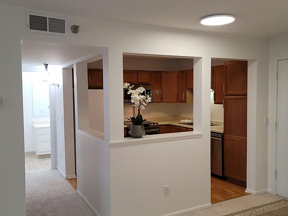 kitchen and the corridor leading to the bathroom and the bedroom.