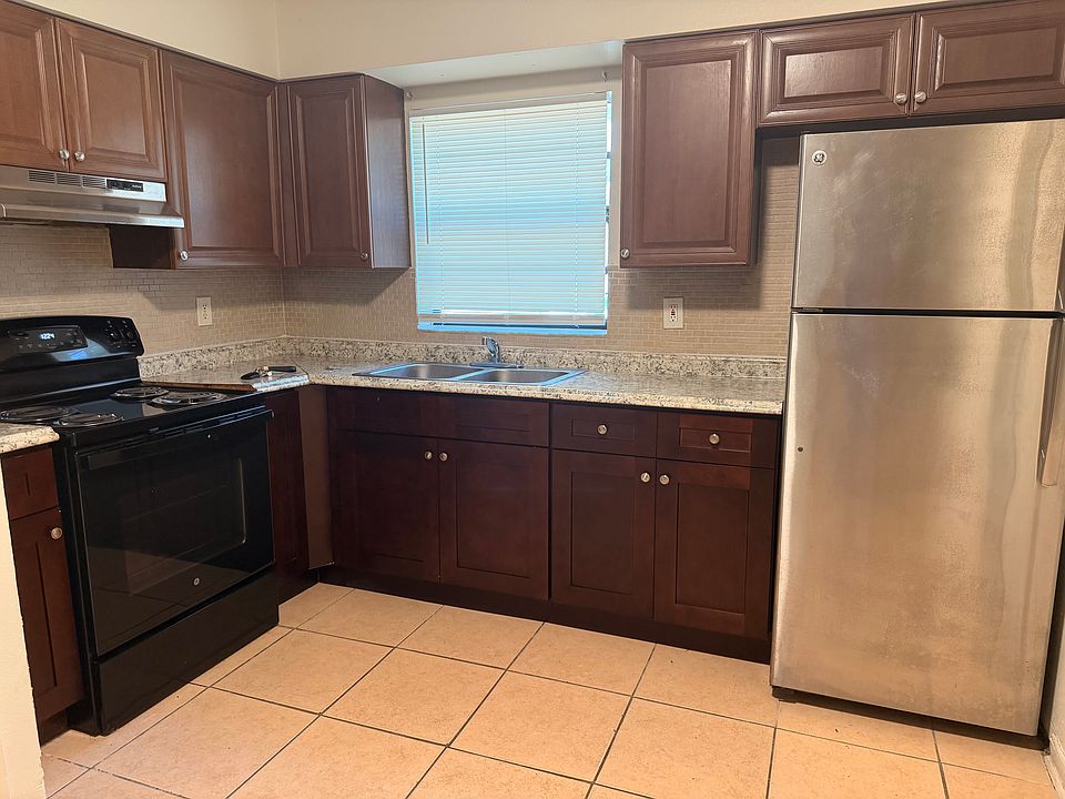 This kitchen features new bottom row cabinets with up-to-date appliances.