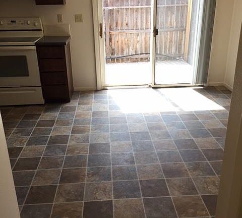 Dining area with sliding door to private fenced patio