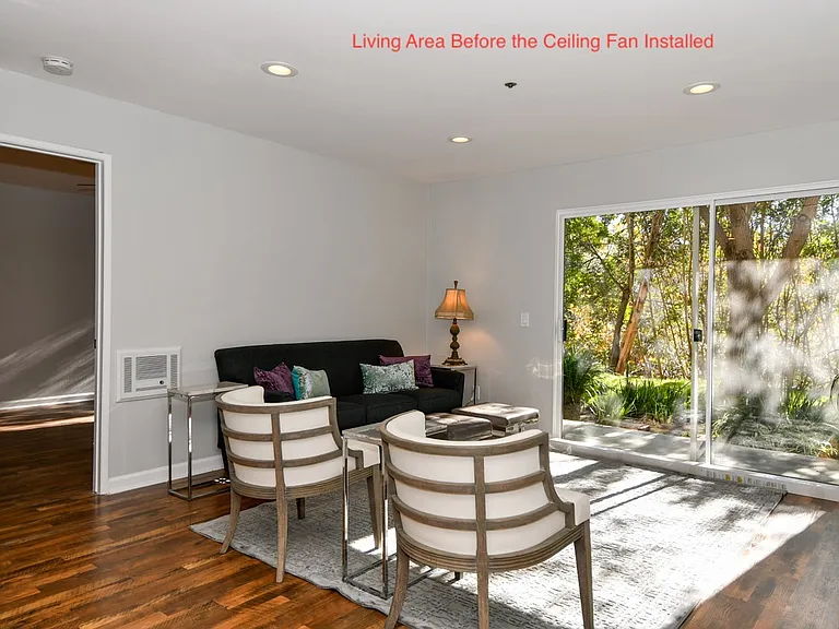 Living room (ceiling fan and vertical blinds have been installed)