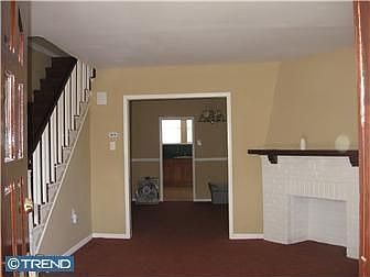 Freshly painted living room with fireplace.