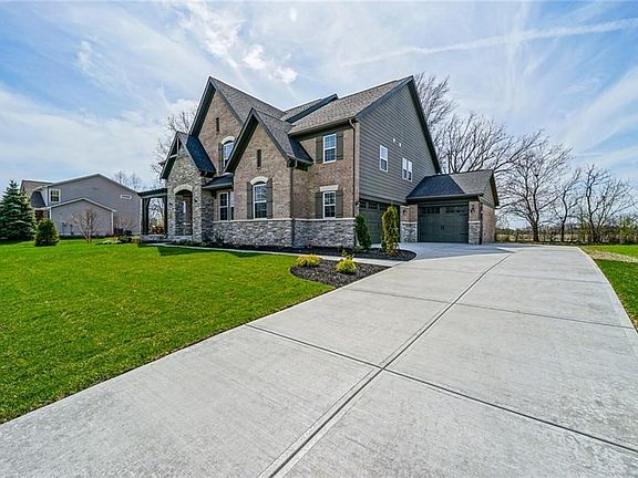 Large Paver Driveway leading you to your 3 Car Garages
