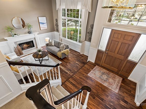 As we go inside the two story entry is glamorous and you can see the living room and stairs that go the bedrooms.>