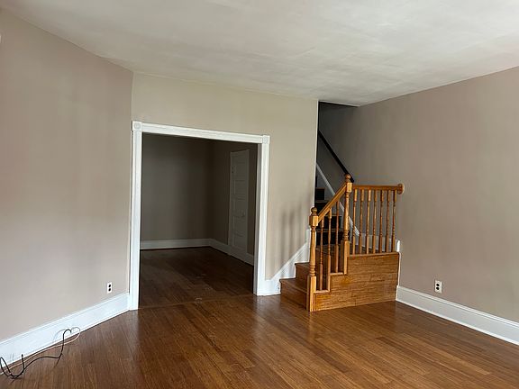 Hardwood floors throughout living room and dining room.