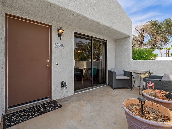 Front patio with sliding glass door access.