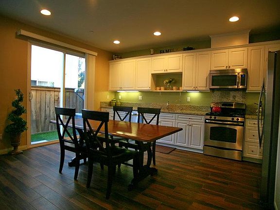 Upgraded Kitchen: cabinets, porcelain tile, and granite coun