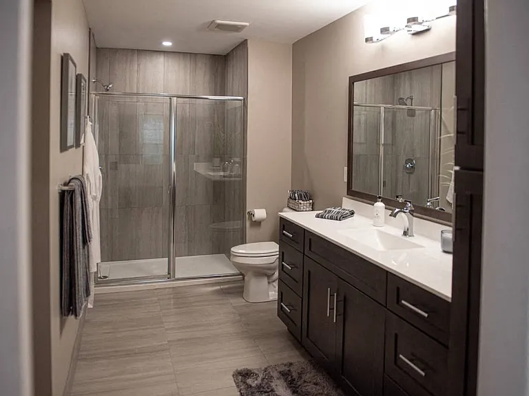 Interior view of Champion Reserve Townhomes primary bathroom with step-in shower.