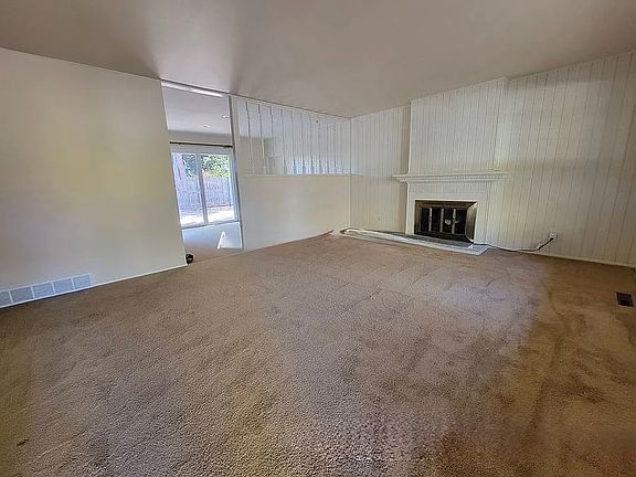 Commodious living room detailed with fireplace welcomes you into 3320 23rdstreet
