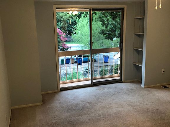 Master bedroom overlooks creek with small balcony
