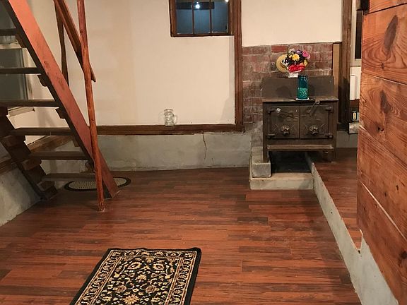 Living room with stairway going up.