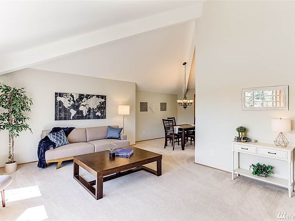 The living room is a great place to gather with open sight lines to the formal dining room.