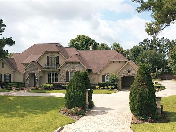 This driveway entrance one of two! The circle driveway entrance curves across the front of the home giving this home a stately, yet welcoming entrance!