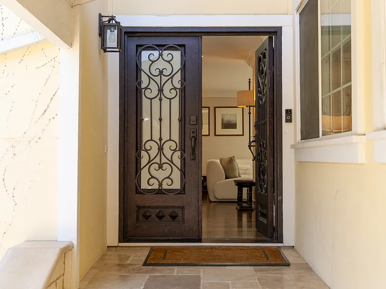 Grand entrance with iron entry doors