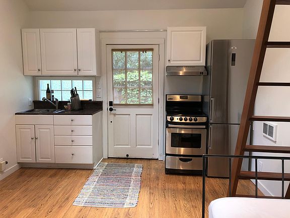 Upgraded kitchen with stainless steel appliances.