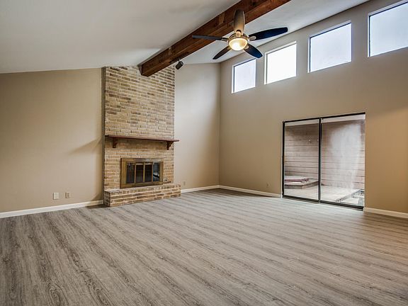 Main Room Features Fireplace and High Ceiling