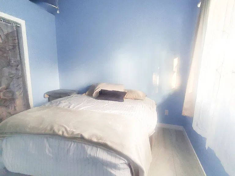 Bedroom with full bed and Chair-bed. Private bathroom with bathtub. Fan and lots of light and privacy curtains.