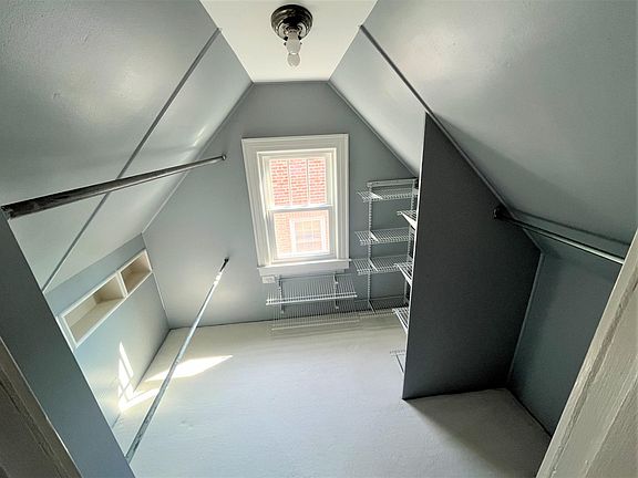Walk in closet with plenty of room for all seasons of clothing! And, natural light pouring in.