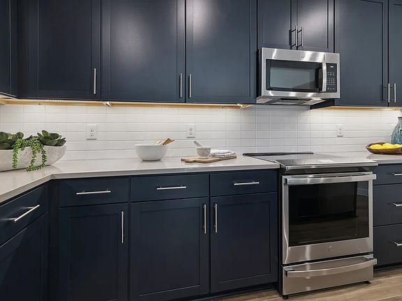 Kitchen with white tile backsplash