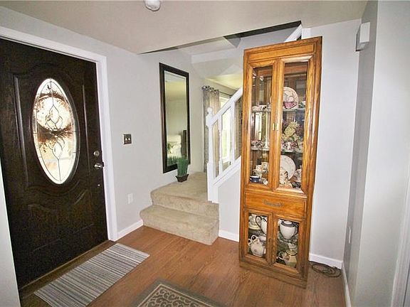 Your guests will be greeted with the beautiful new front door with lead glass window bringing light to the large comfortable ent