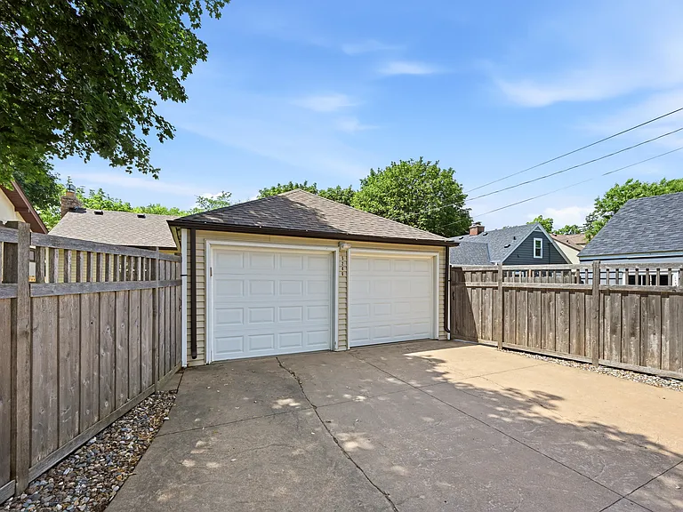 Rear garage with gates to each of the side yards.