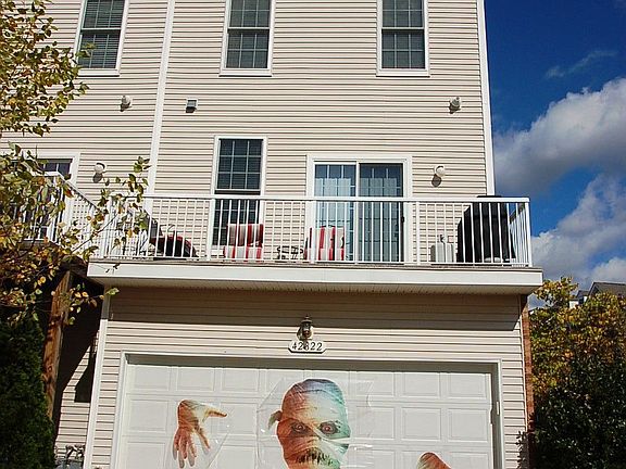 REAR OF HOME w/ 2 CAR GARAGE
