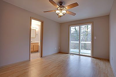 The master suite is located at the back of the home for plenty of privacy plus a view of the woods. 