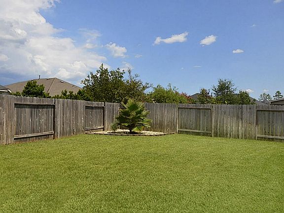 There is still plenty of room in this fully fenced backyard for a pool and playset.