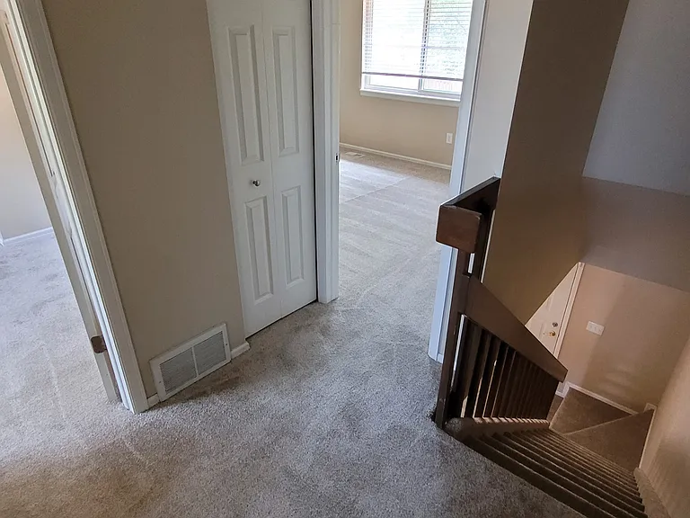 Top of Stairs. Looking at Linen Closet in the Hall and into the Master Bedroom