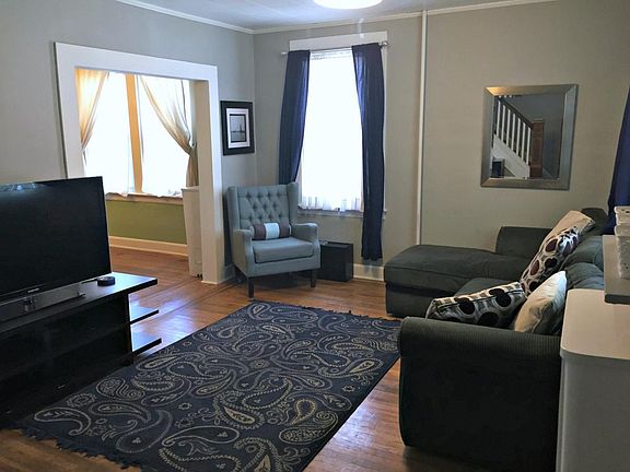 Charming living room with original hardwood and fresh paint