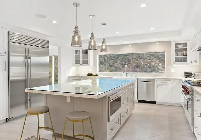These classic lines of the kitchen area are perfectly suited for a panoramic view of this hillside in Los Angeles.