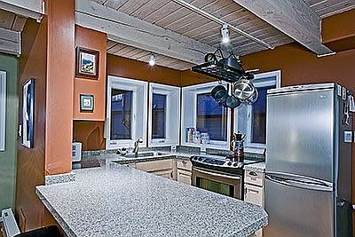 Kitchen with granite composite countertops and stainless steel appliances