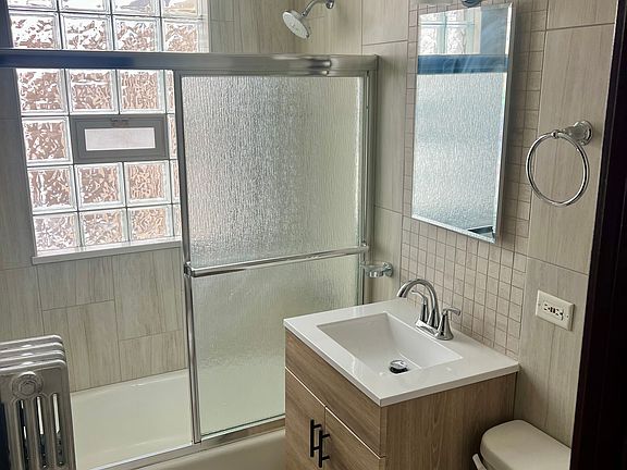 NEWLY RENOVATED W/ FLOOR TO CEILING TILES