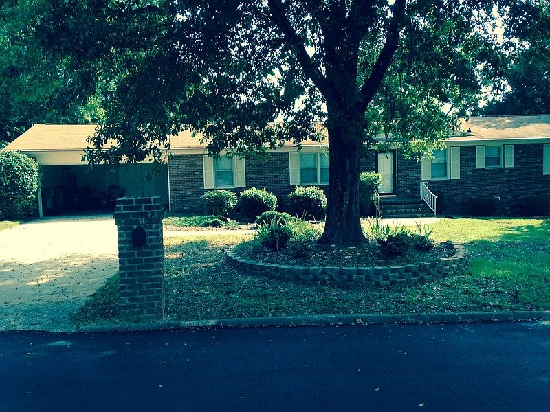 Front view of home. Note (attached) 2 car garage on left
