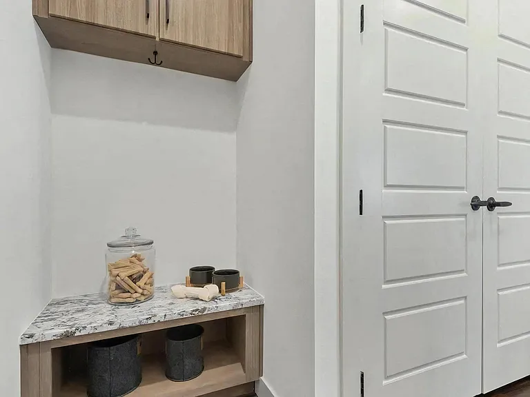 Apartment Entryway Featuring Built-In Cabinets with Storage Hooks