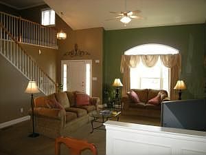 Great Room with cathedral ceiling and transom window
