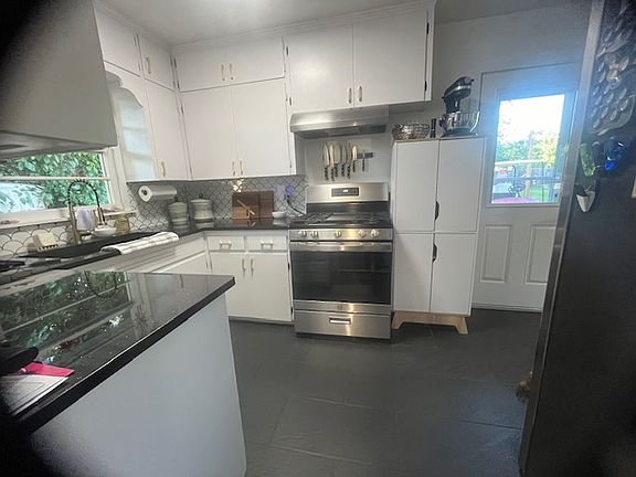View into the kitchen from the laundry/garage entry.