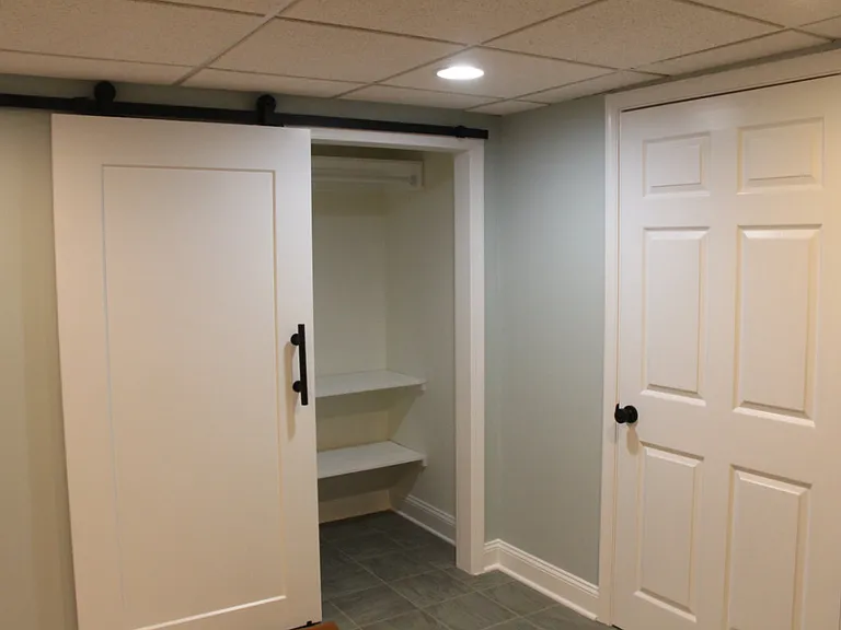 Bedroom with plenty of storage areas.