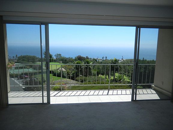 Living room and balcony; Cruise ships frequently go by