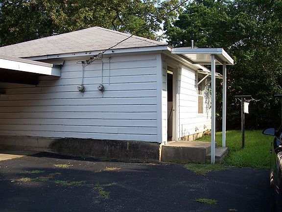 Convenient Laundry Room with 2 Washers and 2 Dryers + Storag